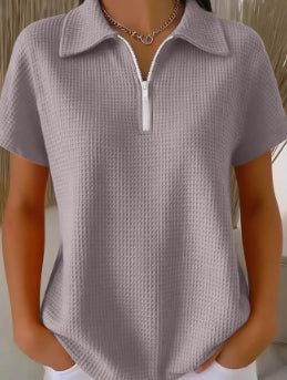 Drop shoulder waffle knit top by Plush Fashion Hub, featuring 3/4 sleeves and a half-zip pullover design.