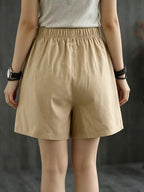 Elastic waist casual shorts by Trendsi featuring a relaxed fit, soft fabric, and versatile style for everyday wear.