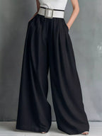 Shopimist high-waisted wide-leg pants with a relaxed fit, featuring flowing fabric and a modern silhouette.