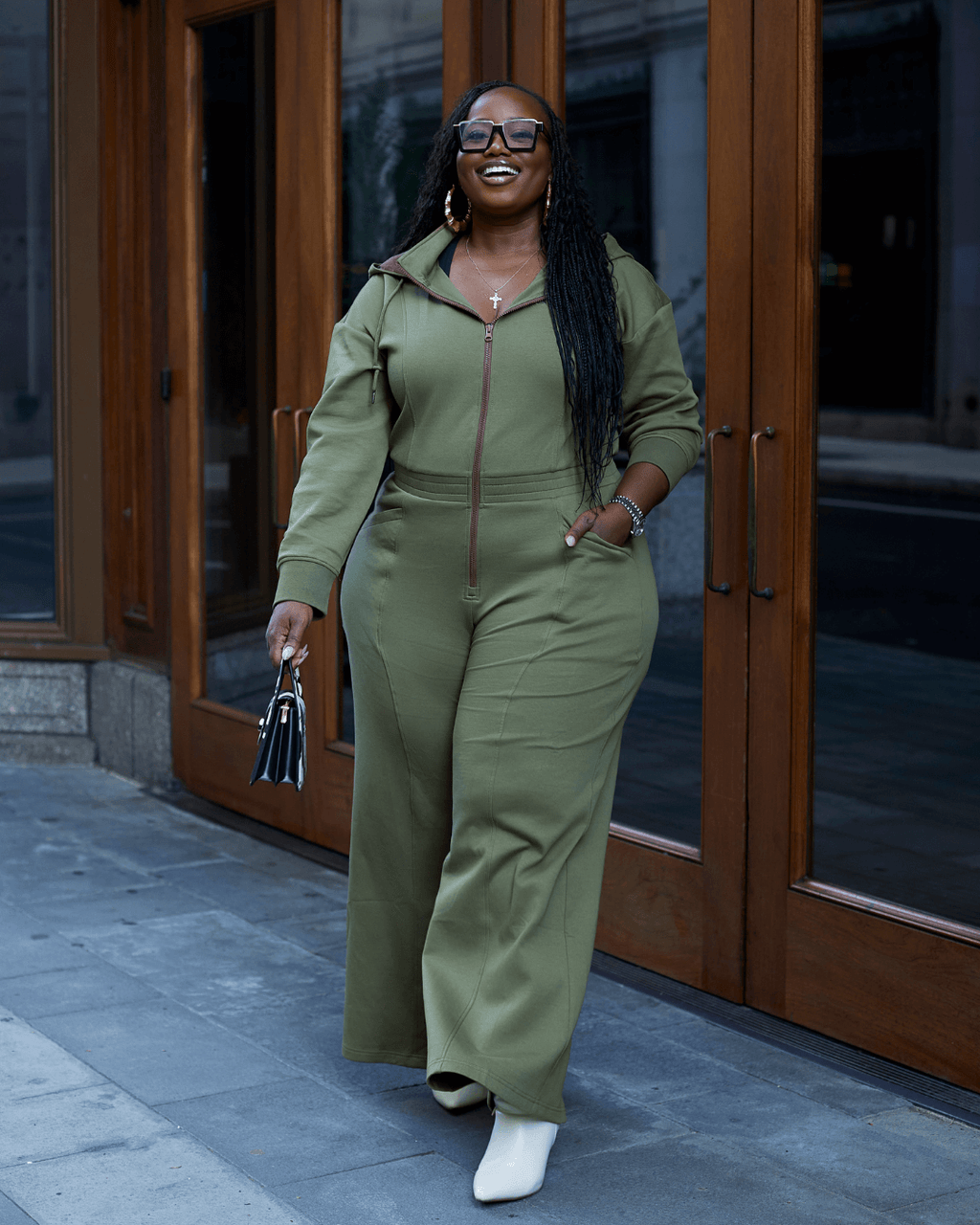 Green satin-lined jumpsuit by Plush Fashion Hub featuring a stylish, fitted design with long sleeves and a tapered pant leg.