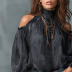 Women's retro cashew print off-shoulder blouse with lantern sleeves, casualwear by Plush Fashion Hub, shown on a model.