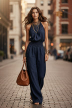 Women's sleeveless backless lace-up halter wide-leg jumpsuit in casualwear style, featuring lightweight fabric and stylish design.