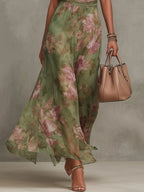 Plus size floral print sleeveless maxi dress from Trendsi, flowing dress with vibrant floral pattern and full length.