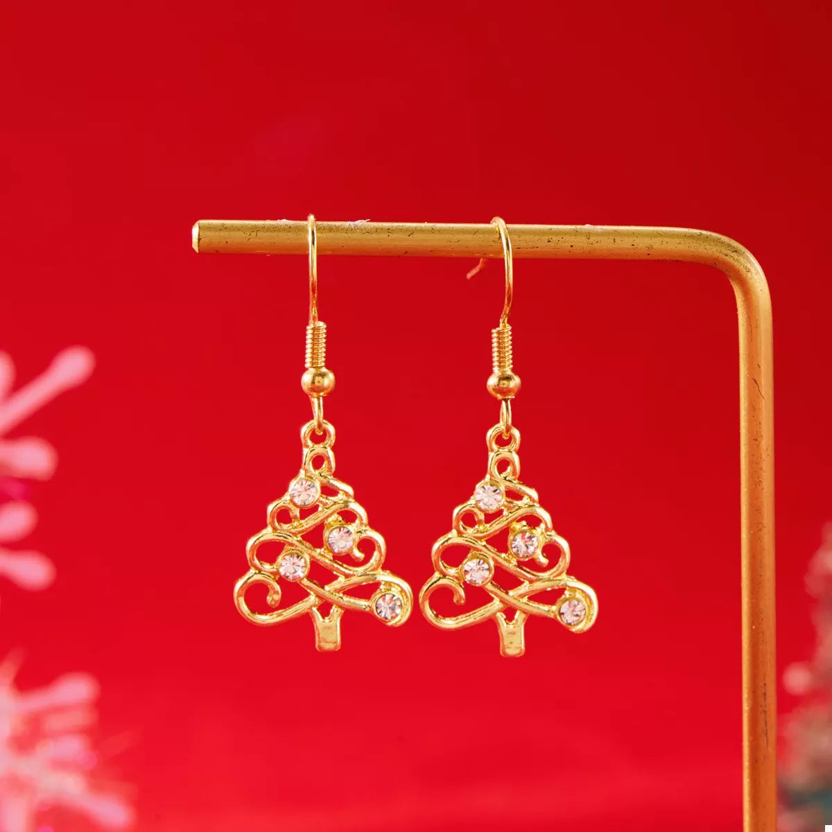 18K gold-plated rhinestone Christmas tree dangle earrings with sparkling embellishments on silver hooks.