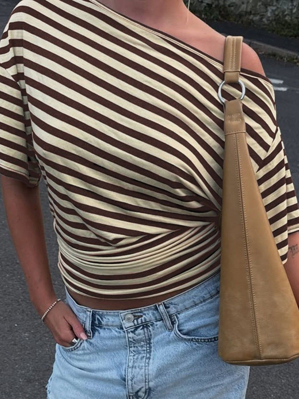 Women's striped one-shoulder T-shirt by Trendsi featuring a chic, asymmetrical design and comfortable fit.