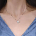 Sterling silver zircon pendant necklace featuring a sparkling gemstone on a delicate chain, stylish jewelry accessory.