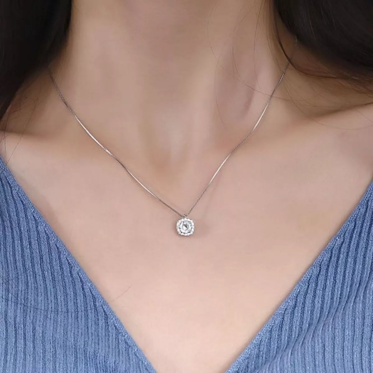 Sterling silver zircon pendant necklace featuring a sparkling gemstone on a delicate chain, stylish jewelry accessory.