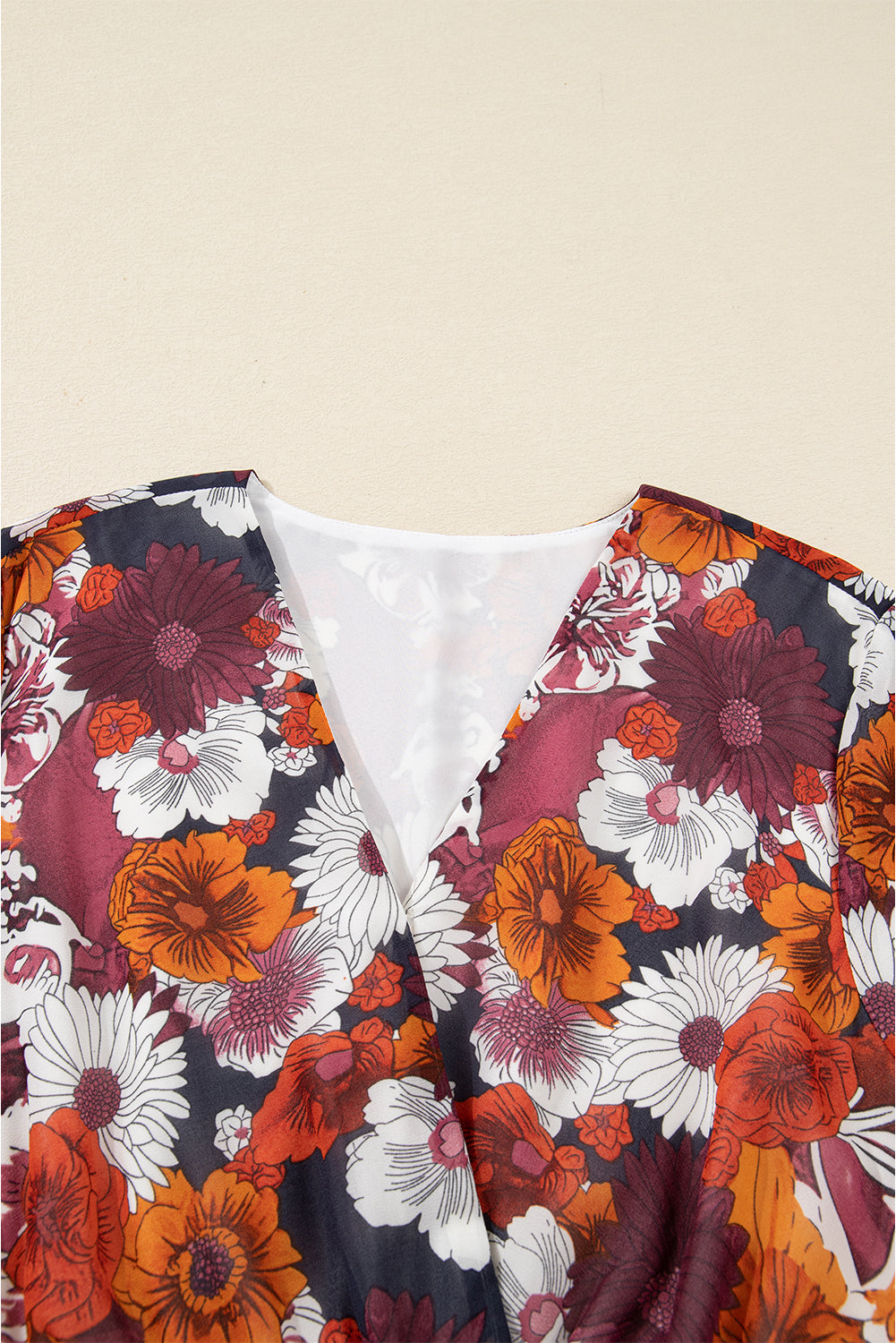 Flowy Marianna Mini Dress by Threaded Pear with floral pattern, featuring long sleeves and a lightweight, breezy design.