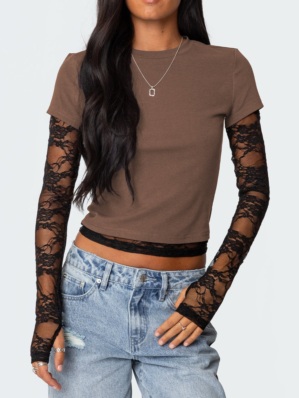 Women's fitted lace sleeve T-shirt by Trendsi featuring elegant lace details and a sophisticated casual style.