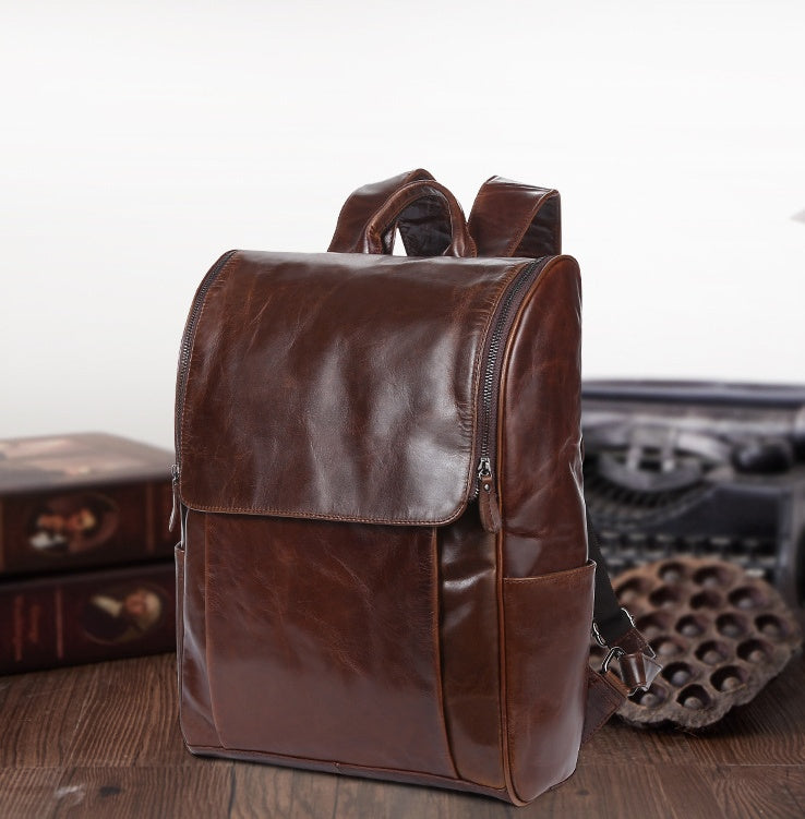 Black leather computer backpack with plush accents, featuring multiple compartments and adjustable straps, from Plush Fashion Hub.
