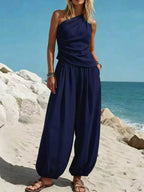 Plus size one-shoulder top and wide-leg pants set by Plush Fashion Hub, featuring a stylish matching pieces ensemble.