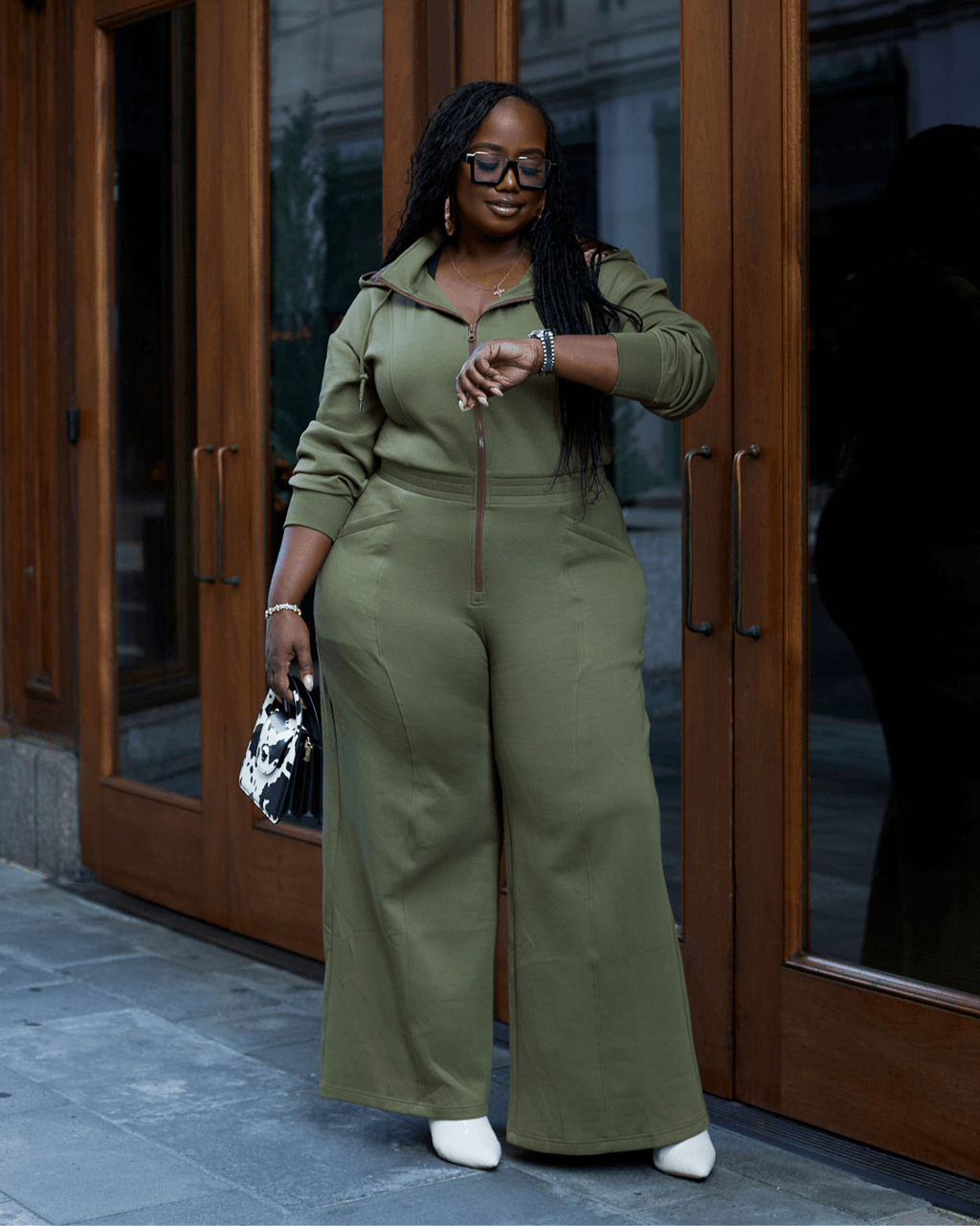 Green satin-lined jumpsuit by Plush Fashion Hub, featuring a sleek fit and elegant fabric, displayed on a model.