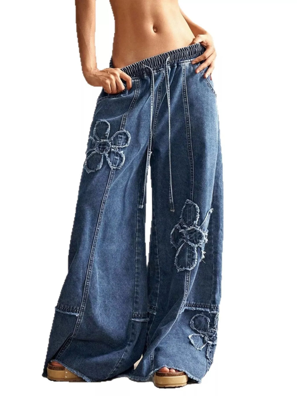 Wide leg jeans with floral appliqué details from Shopimist, showcasing embroidered flower patterns on denim fabric.