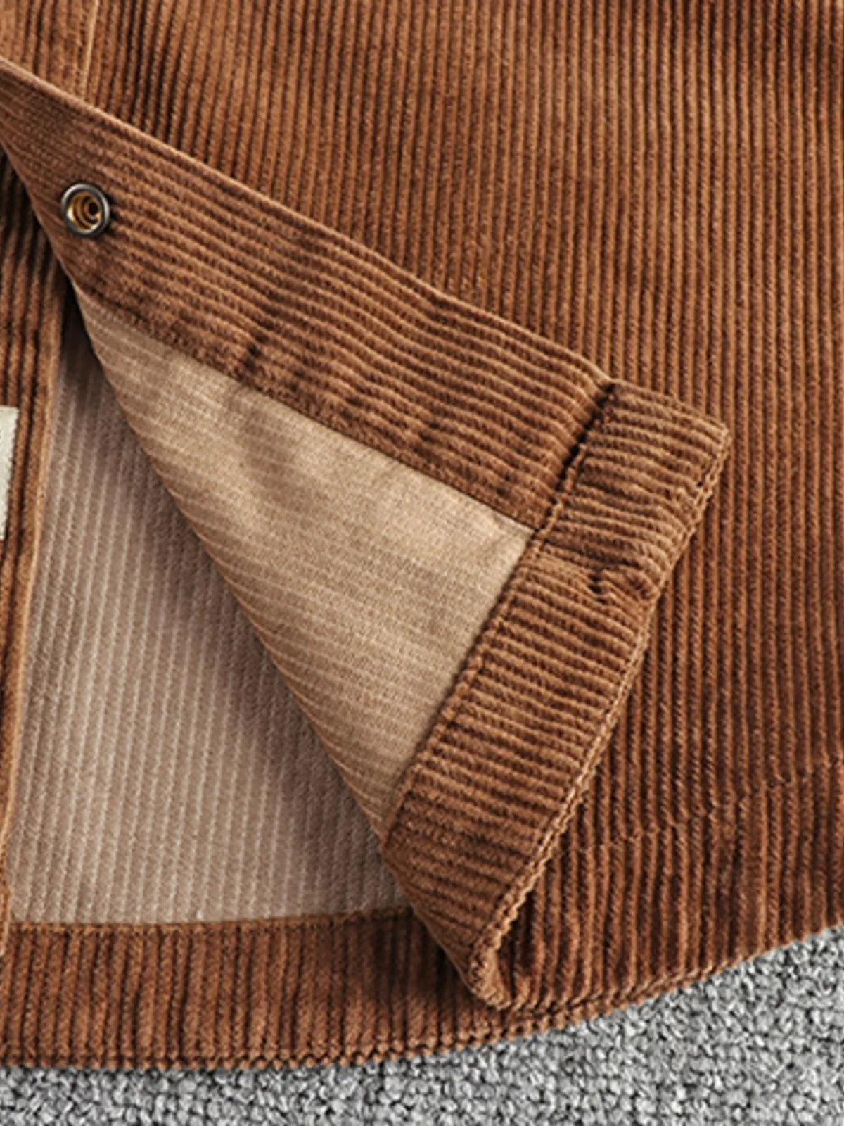 Men's plus size corduroy button-up long sleeve jacket by Trendsi, shown in a stylish fit with front buttons and textured fabric.