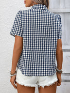 Women's lightweight plaid button-up short sleeve shirt by Trendsi, showcasing a casual, stylish design with a classic plaid pattern.