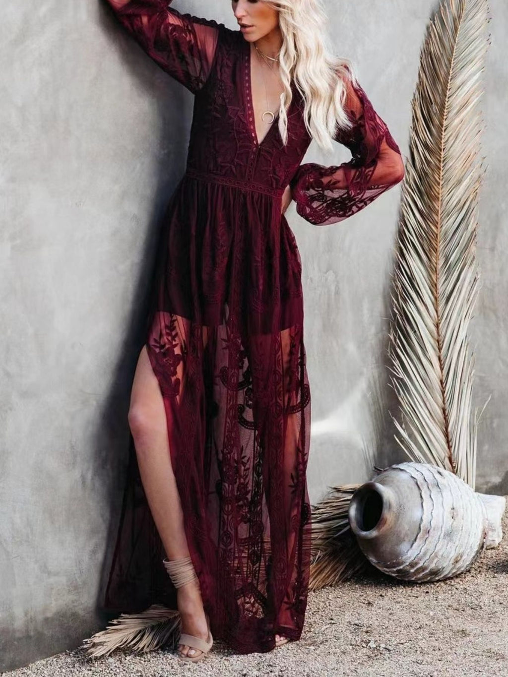 Floral lace high-slit maxi dress by Trendsi featuring elegant evening gown design, flowing fabric, and floral lace details.