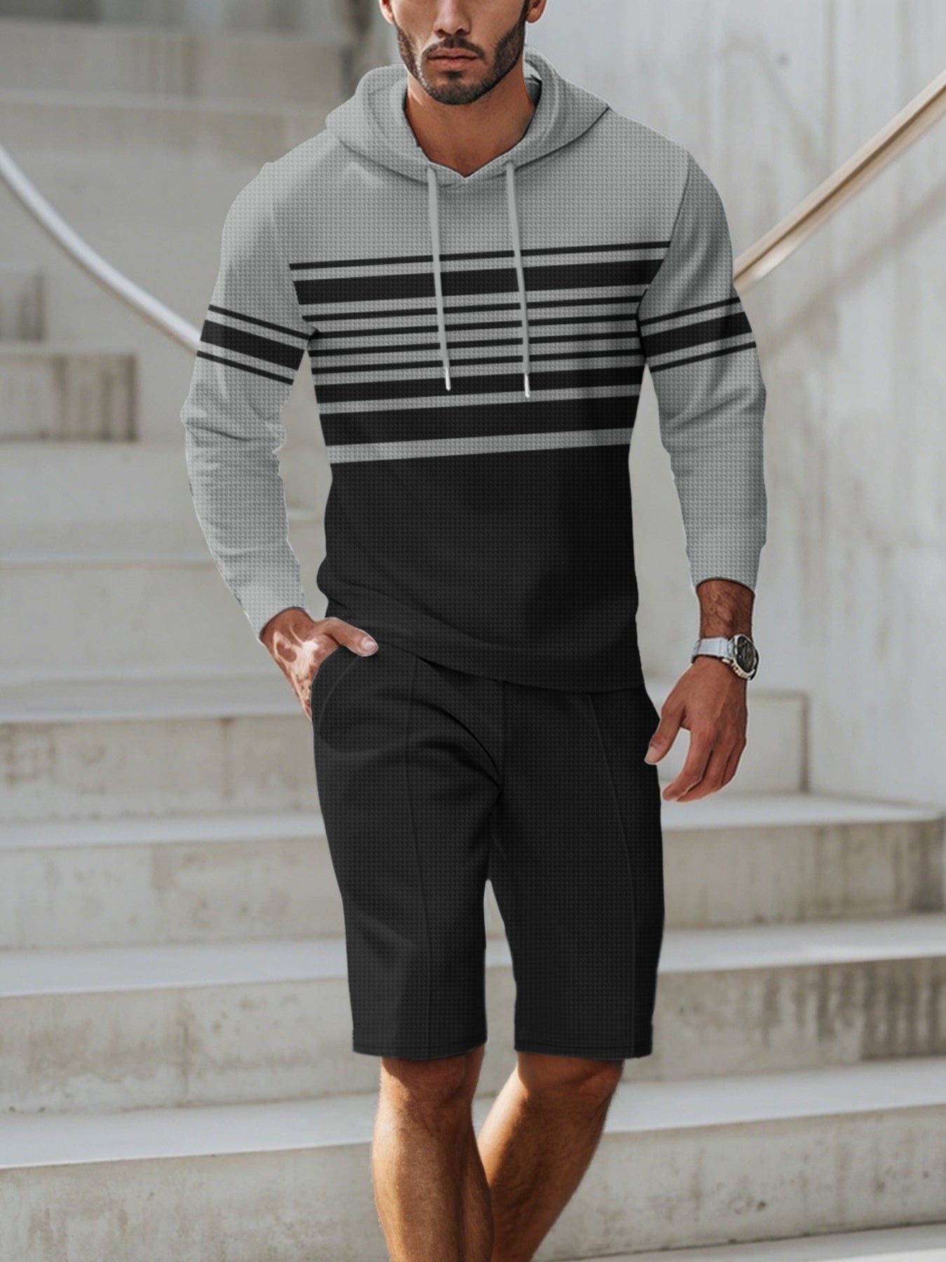 Men's full size striped hoodie and shorts casual set by Trendsi, featuring comfortable matching bottoms and top in a stylish striped design.