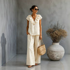 Women's V-neck ruffled hem top and wide-leg pants two-piece casualwear set by Plush Fashion Hub, shown in a stylish ensemble.