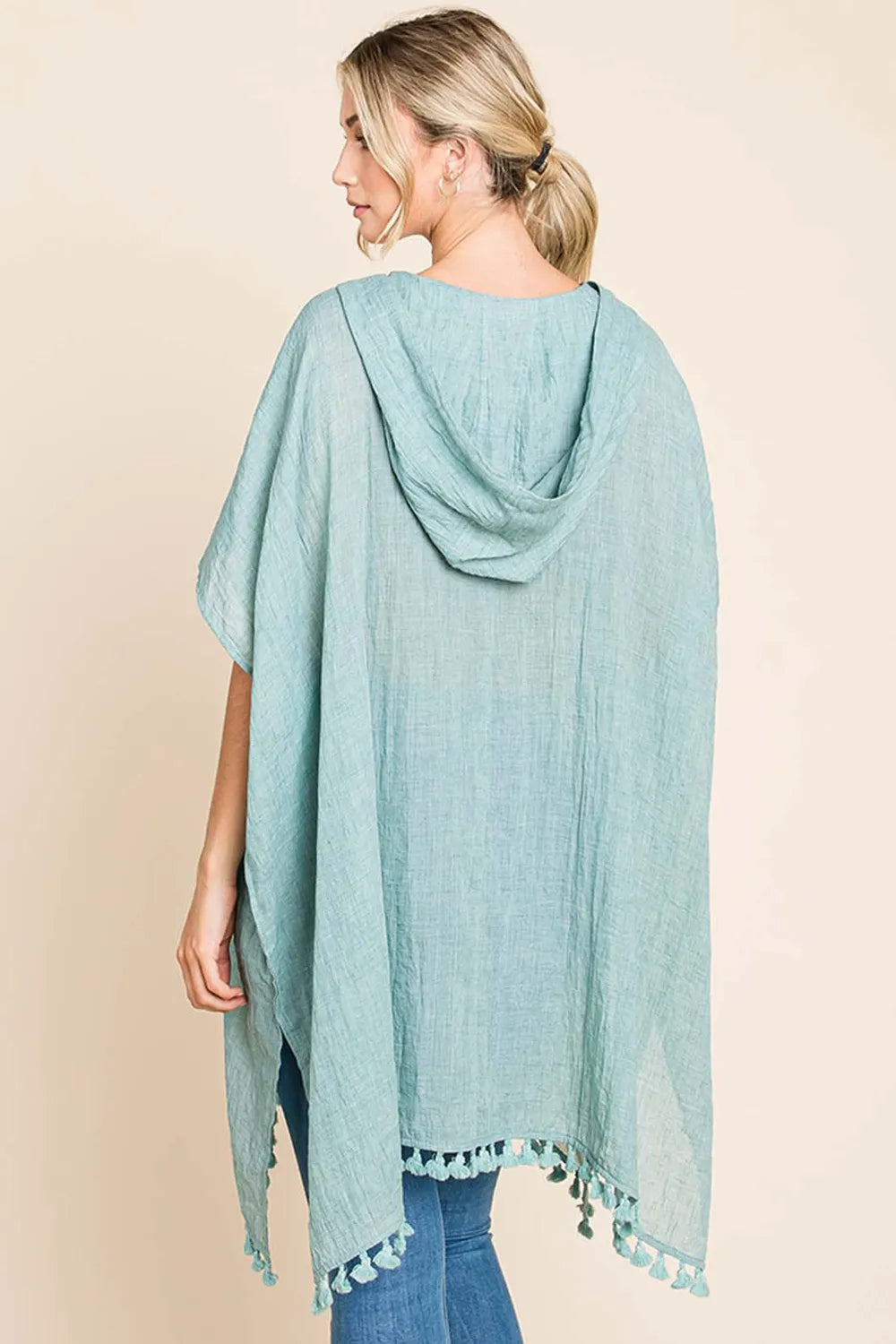 Women's cotton hooded beach cover-up dress with tassel hem, lightweight and breezy for summer beachwear by Trendsi.