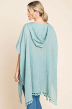 Women's cotton hooded beach cover-up dress with tassel hem, lightweight and breezy for summer beachwear by Trendsi.