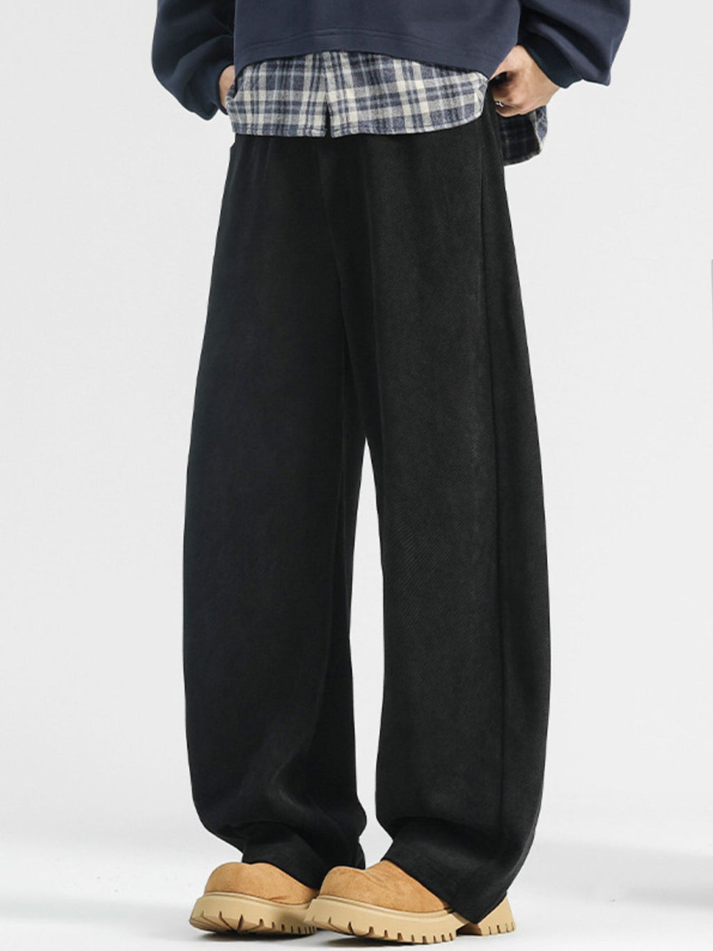 Men's loose fit casual pants with pockets, plus size, comfortable trendy trousers by Trendsi, shown in a relaxed fit with side pockets.