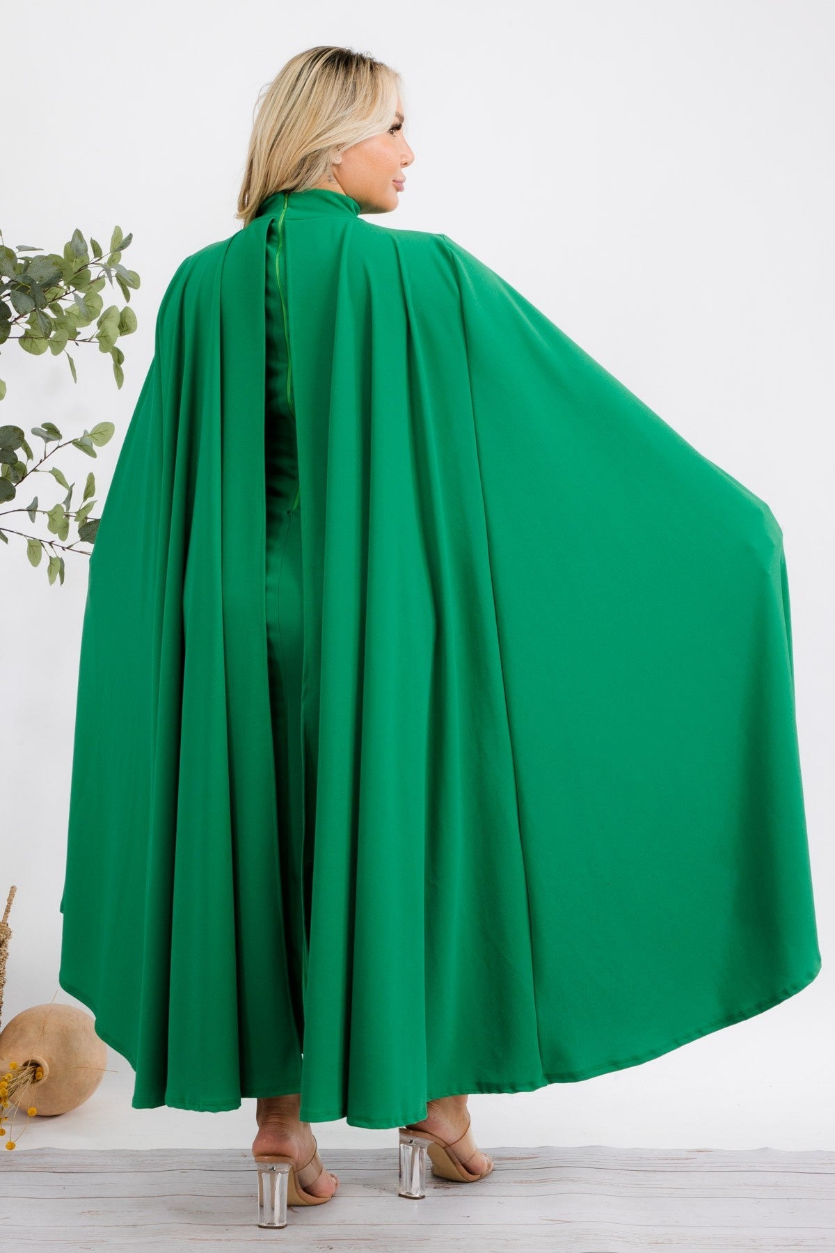 Green Stella Cape plus size midi dress by Fasheabe, featuring a flowing cape detail and elegant silhouette.