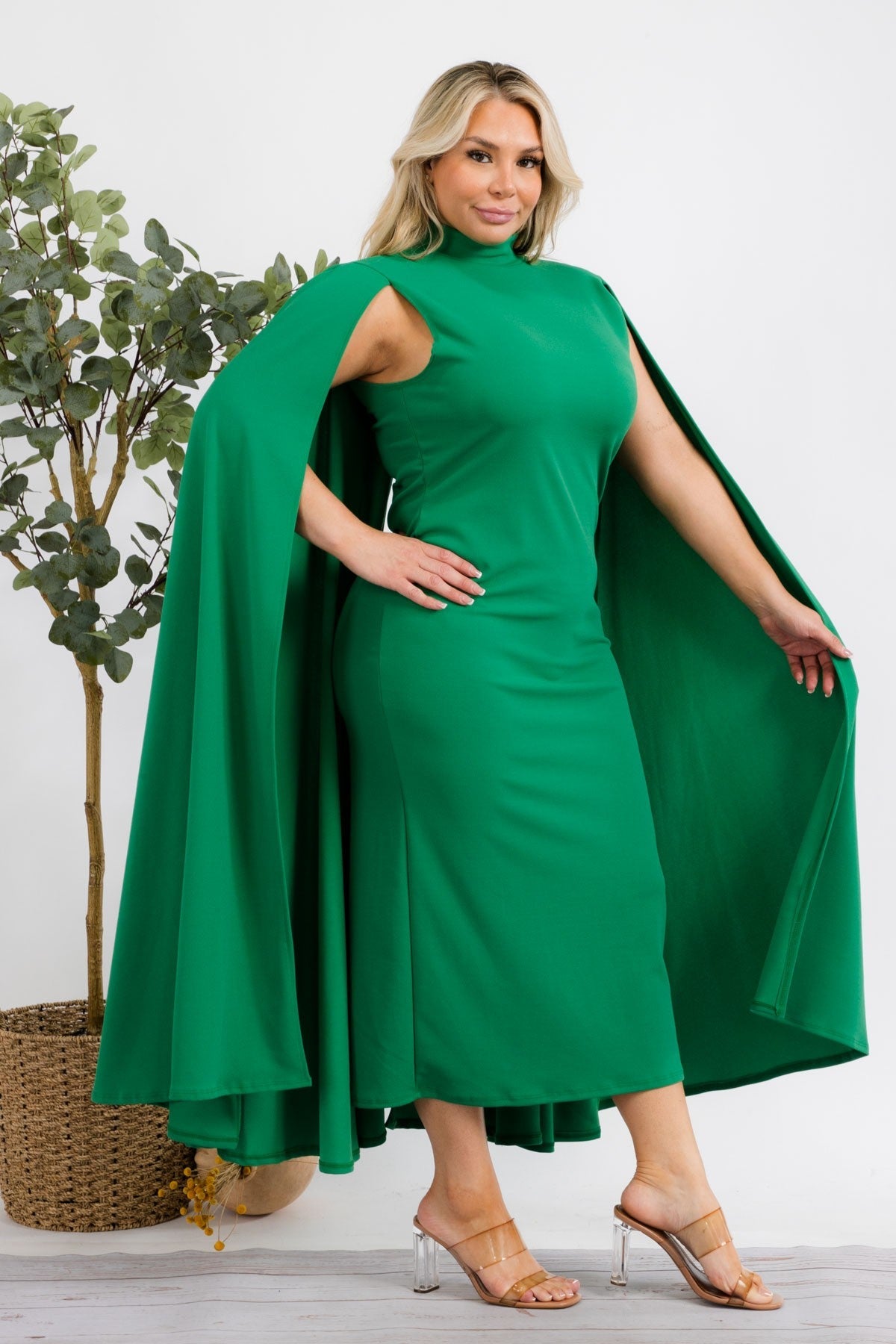 Plus size green midi dress from Fasheabe's Stella Cape collection, featuring a stylish and elegant design.