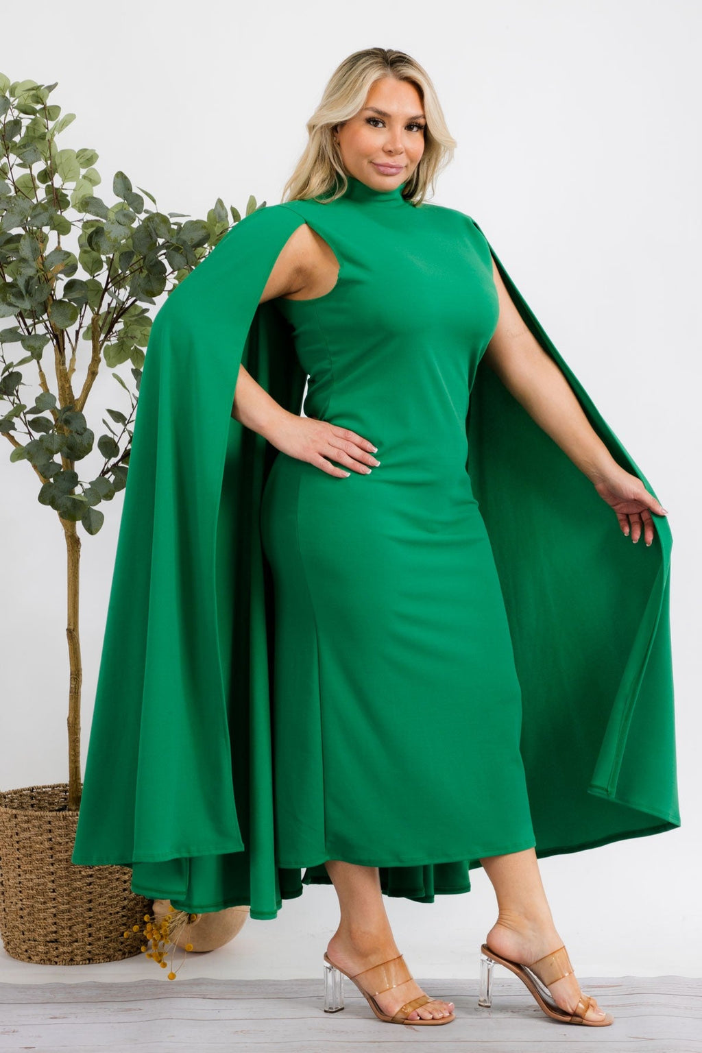 Green Stella Cape plus size midi dress by Fasheabe featuring a stylish cape design and flowing silhouette.