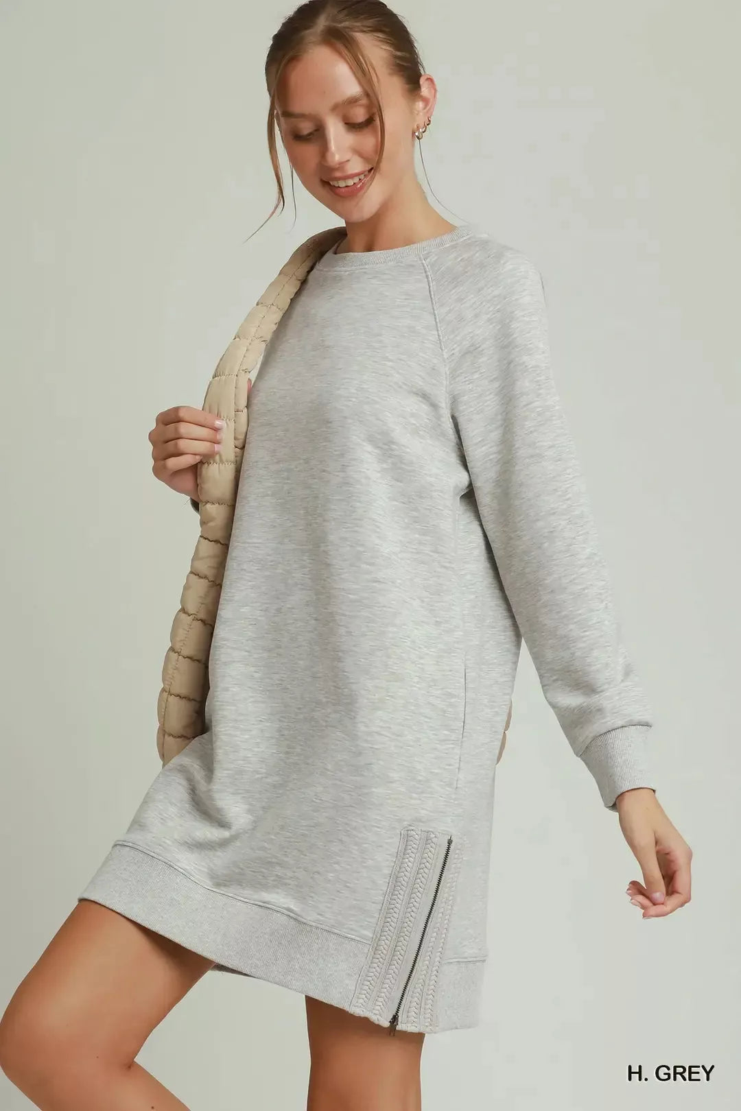 Umgee crochet zipper detail dress featuring side crochet accents, stylish and comfortable for casual or semi-formal occasions.