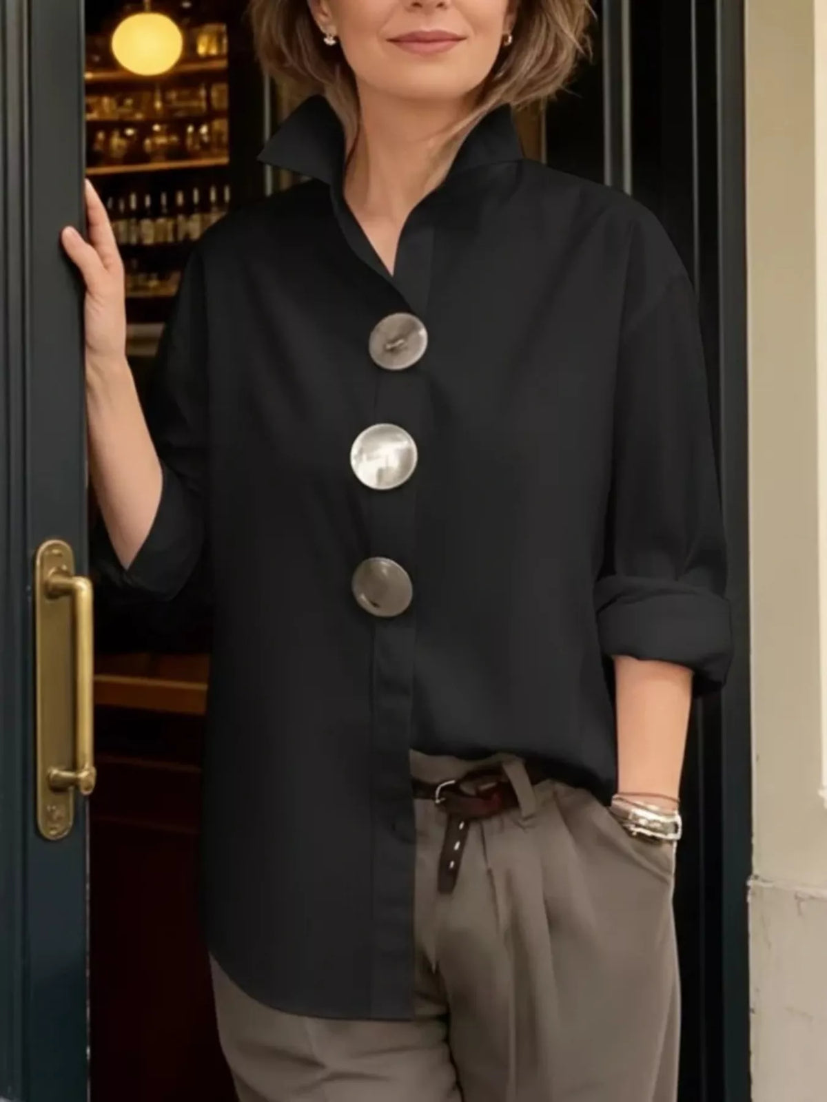 Plus size oversized metal button long sleeve shirt from Trendsi, featuring a relaxed fit and stylish design.