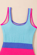 Threaded Pear Rory patchwork one-piece swimsuit with colorful geometric pattern, featuring a stylish cut and vibrant design.