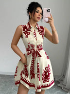 Sleeveless ruched printed tie waist dress by Shopimist featuring a floral pattern and a flattering waist tie.