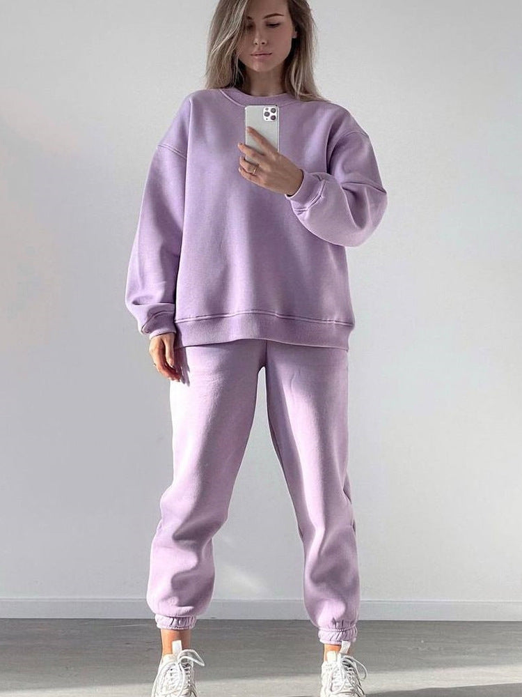 Women's loose fit crewneck sweatshirt and jogger pants two-piece set from Plush Fashion Hub, shown in a casual, comfortable outfit.
