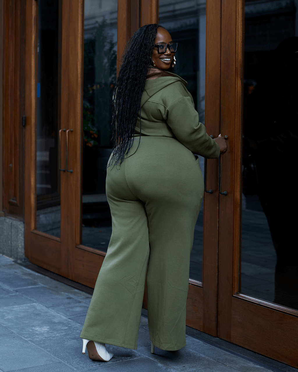 Green satin-lined jumpsuit by Plush Fashion Hub featuring a stylish, fitted design with long sleeves and a flattering silhouette.
