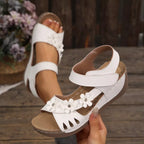 Floral embellished wedge sandals by Shopimist featuring colorful flower details and tan leather straps.