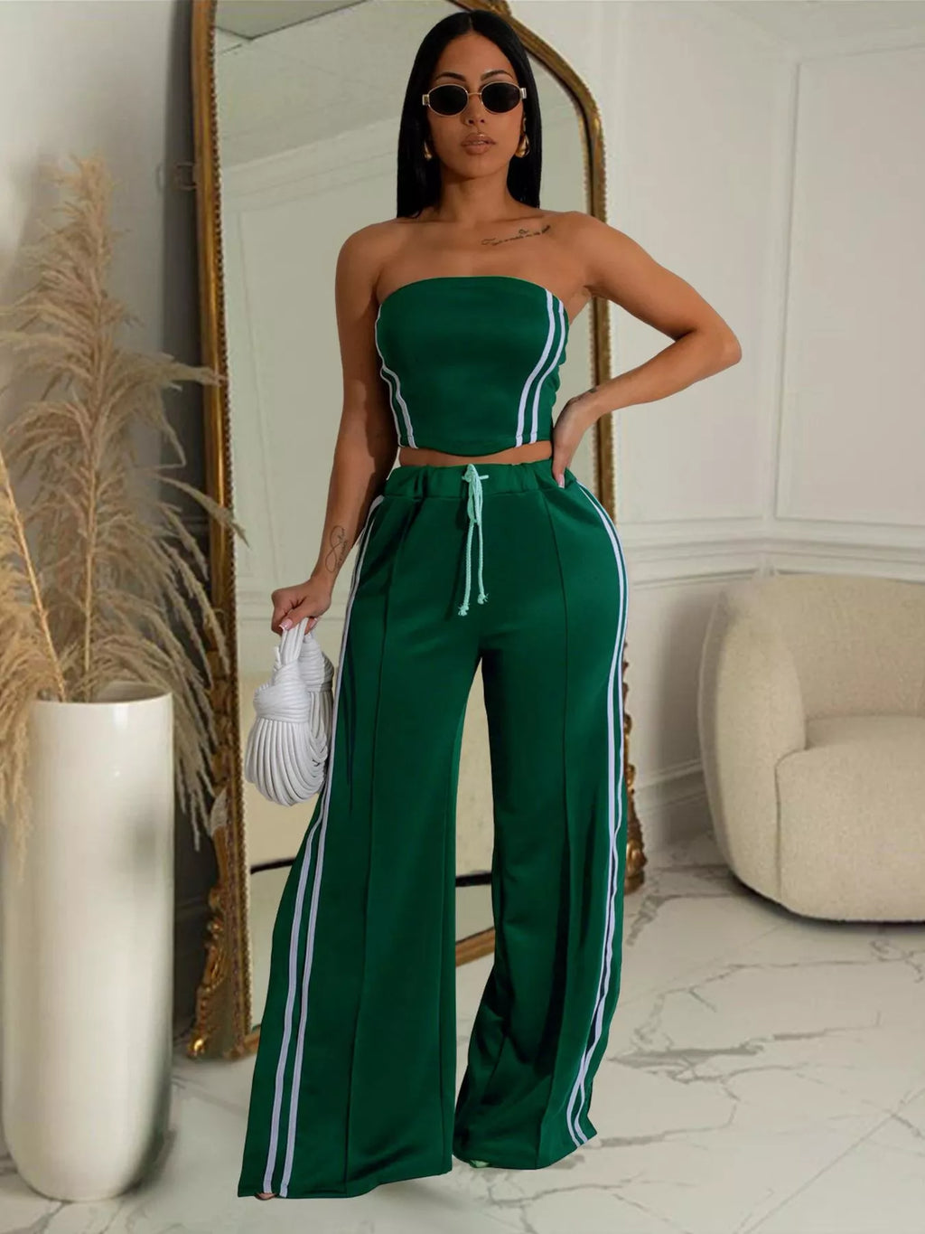 Trendsi sleeveless tube top and wide-leg pants set, stylish casual outfit, black fabric, perfect for summer or relaxed occasions.