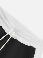 Plus size men's sweatpants by Trendsi with contrast stripe drawstring waistband and relaxed fit, shown in the image.