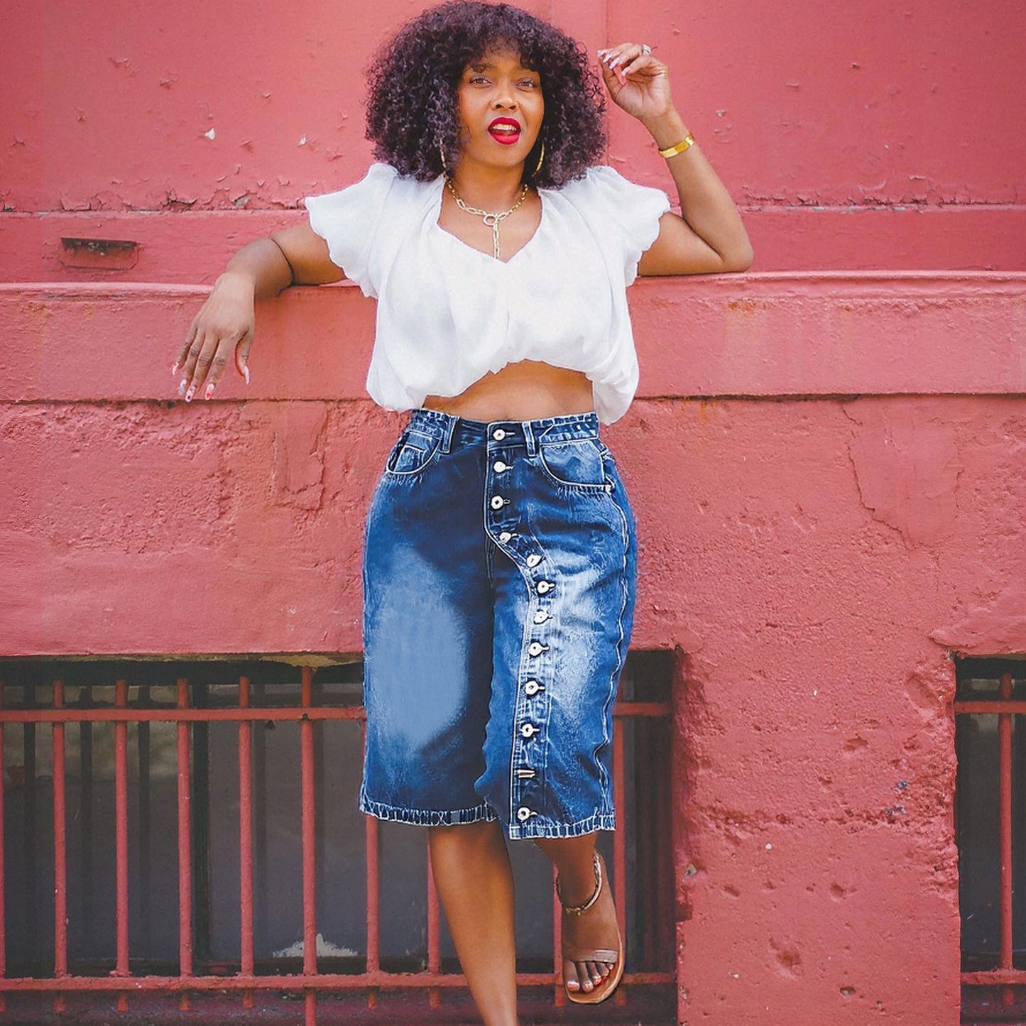High-waisted multi-button denim shorts from Plush Fashion Hub, featuring a classic blue denim look and stylish button details.