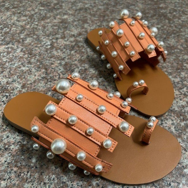 Pearl-embellished Plush Fashion Hub beach toe loop flat sandals with decorative pearls and comfortable flat sole.