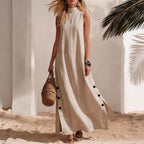 FitiqueFit sleeveless midi dress with side slits and loose fit, showcased on a model in a stylish, casual setting.