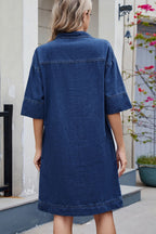 VYSN Johnny Collar half sleeve denim dress hanging on a rack, showcasing its collar and casual style.