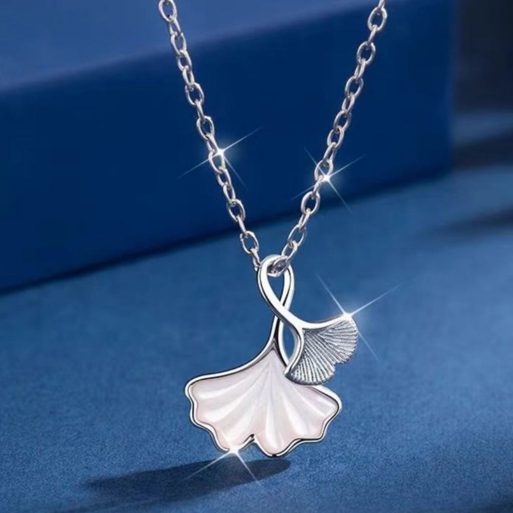 Ginkgo leaf pendant necklace by Shopimist featuring a delicate gold-tone ginkgo leaf charm on a chain.