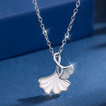 Ginkgo leaf pendant necklace by Shopimist featuring a delicate gold-tone ginkgo leaf charm on a chain.