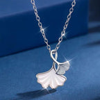 Ginkgo leaf pendant necklace by Shopimist featuring a delicate gold-tone ginkgo leaf charm on a chain.