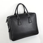 Men's leather briefcase by Plush Fashion Hub, large capacity cowhide handbag with horizontal design and sturdy handles.