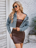 VYSN raw hem denim jacket with front pockets, casual fashion clothing, showing the distressed hem and classic blue denim design.