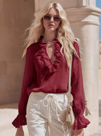 Shopimist ruffled v-neck long sleeve blouse with feminine design and soft fabric, displayed on a hanger.