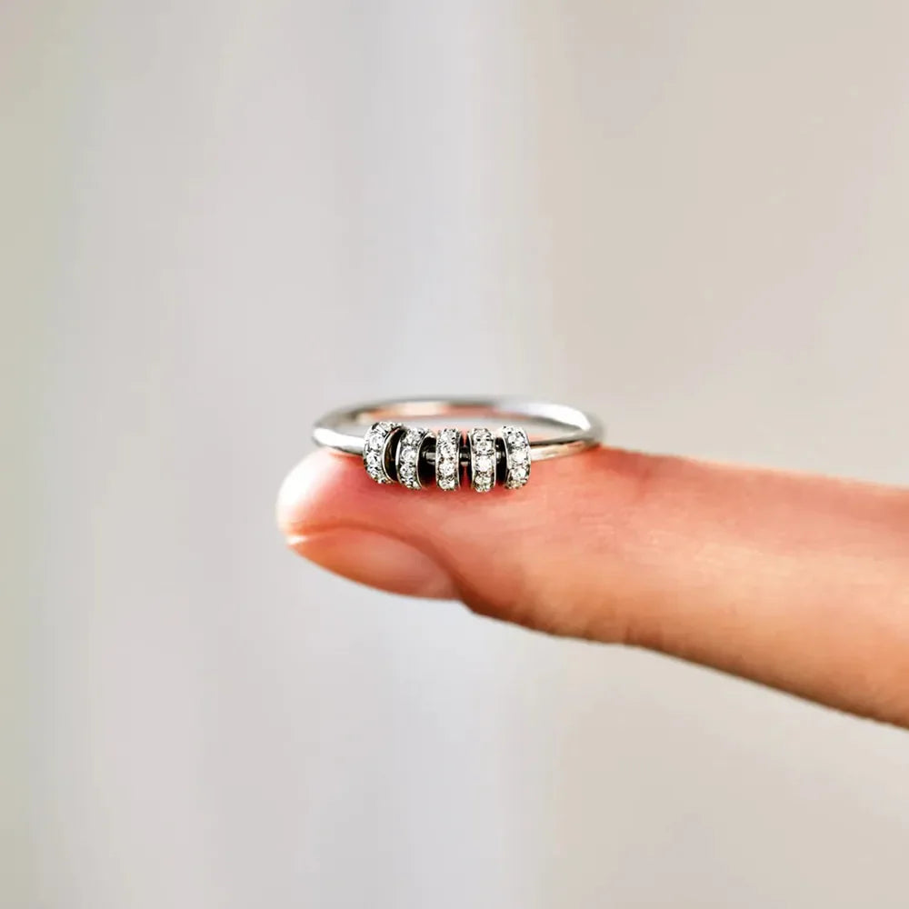 Sterling silver ring with inlaid zircon stones, crafted in 925 silver by Shopimist, showcasing intricate design and sparkling accents.