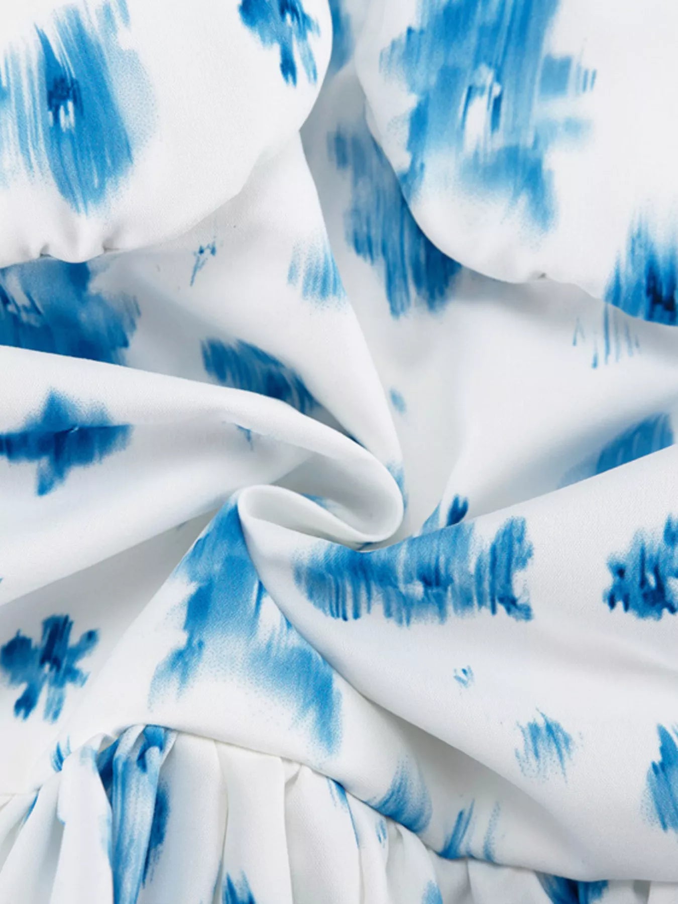Floral print ruffle hem tank top by Shopimist featuring a sleeveless design and feminine ruffle details.