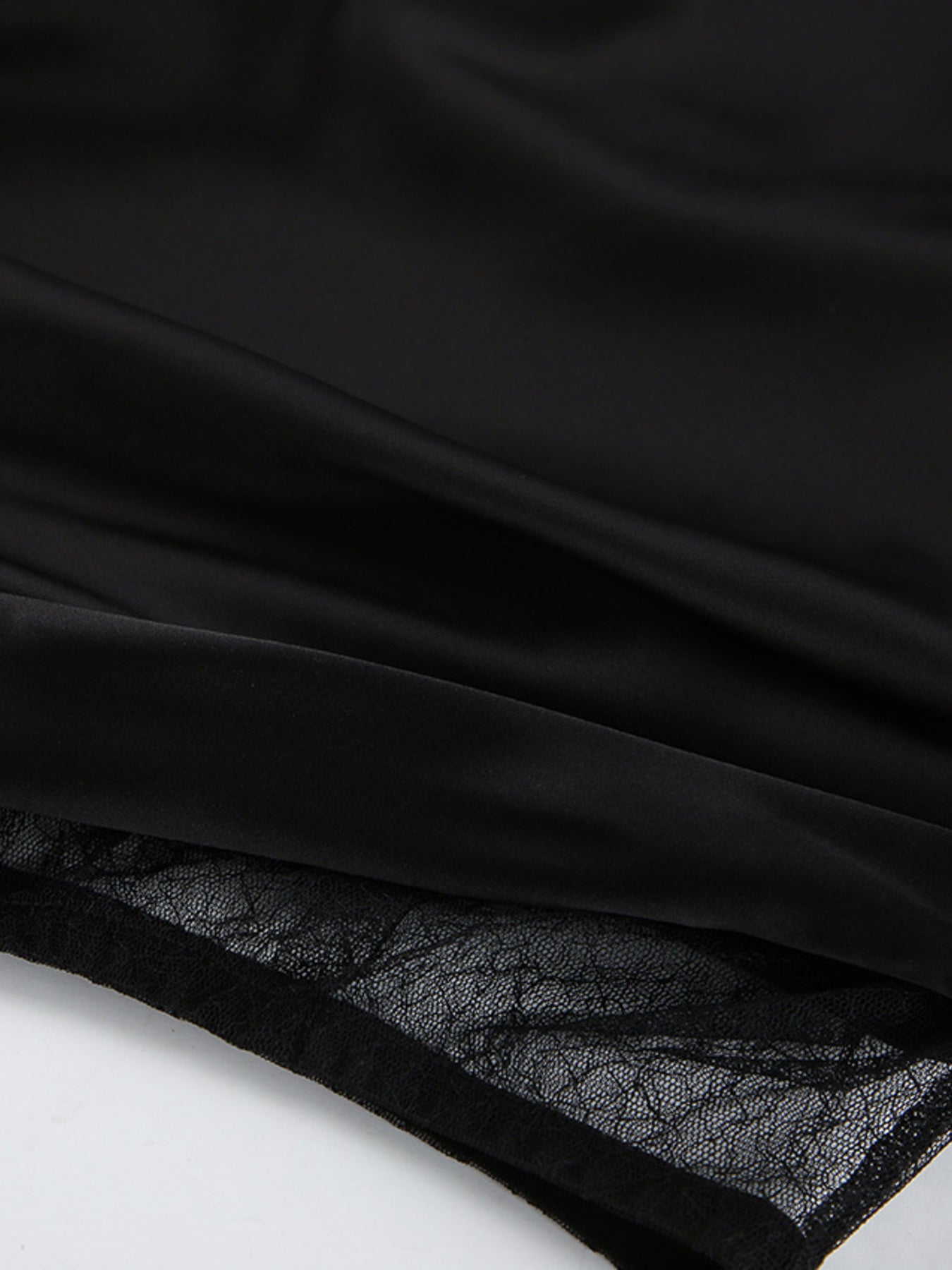 Elegant women's lace midi skirt with sheer split detail, stylish women's apparel by Trendsi, shown with flowing fabric and intricate lace.